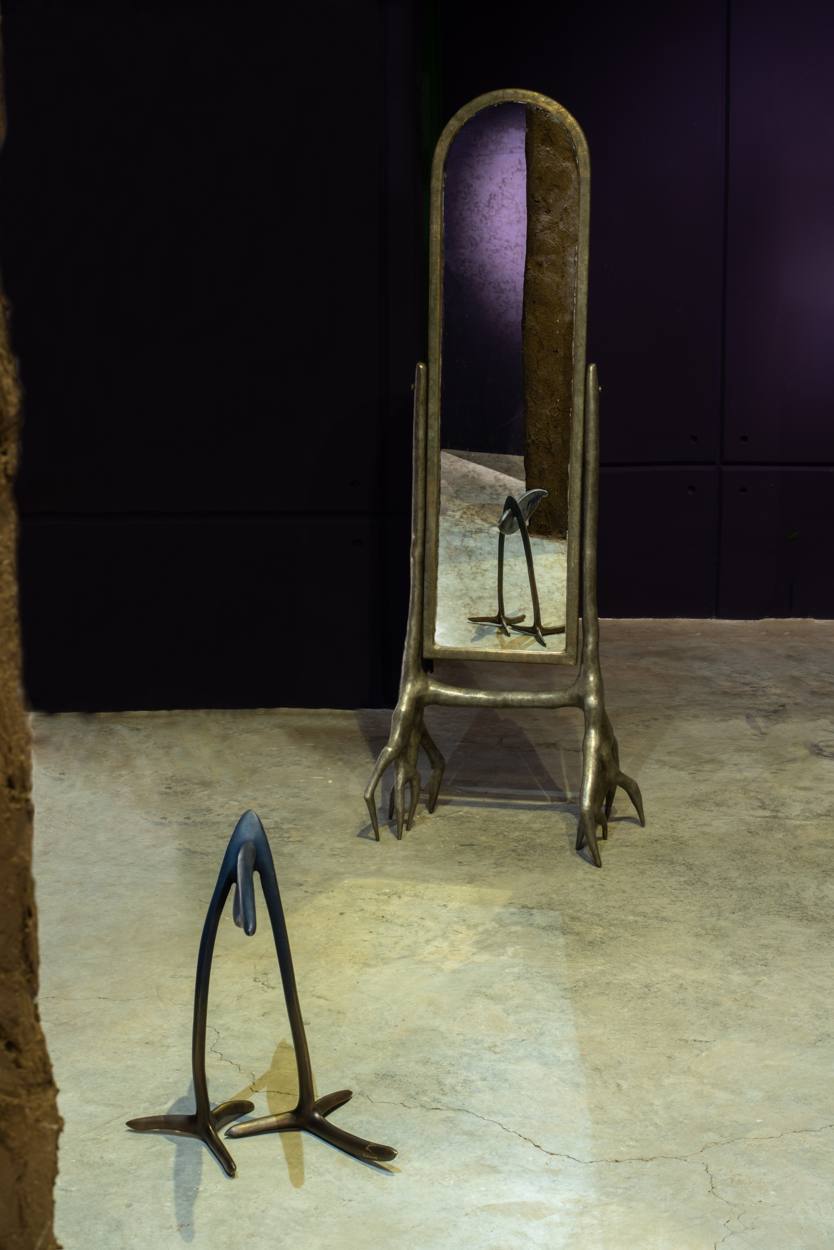 Bronze mirror on clawed feet and a sculpture